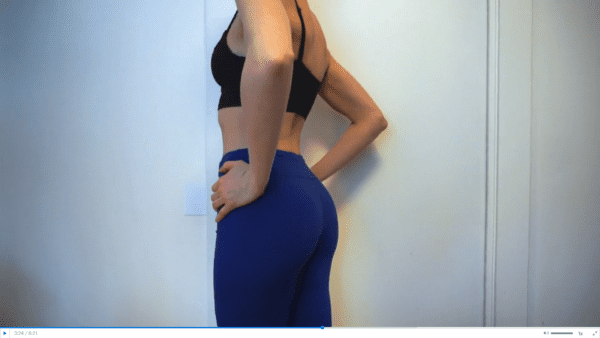 woman wearing black bra and blue yoga pants in panty try on